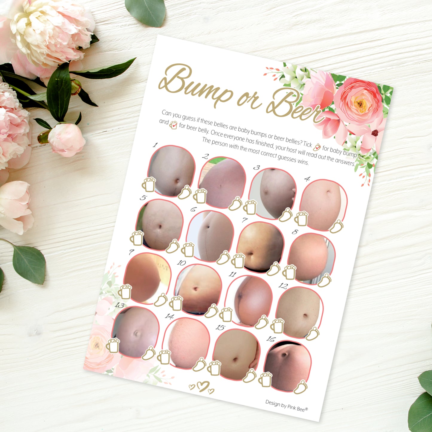 A single baby shower game sheet on a wooden table with peach flowers 